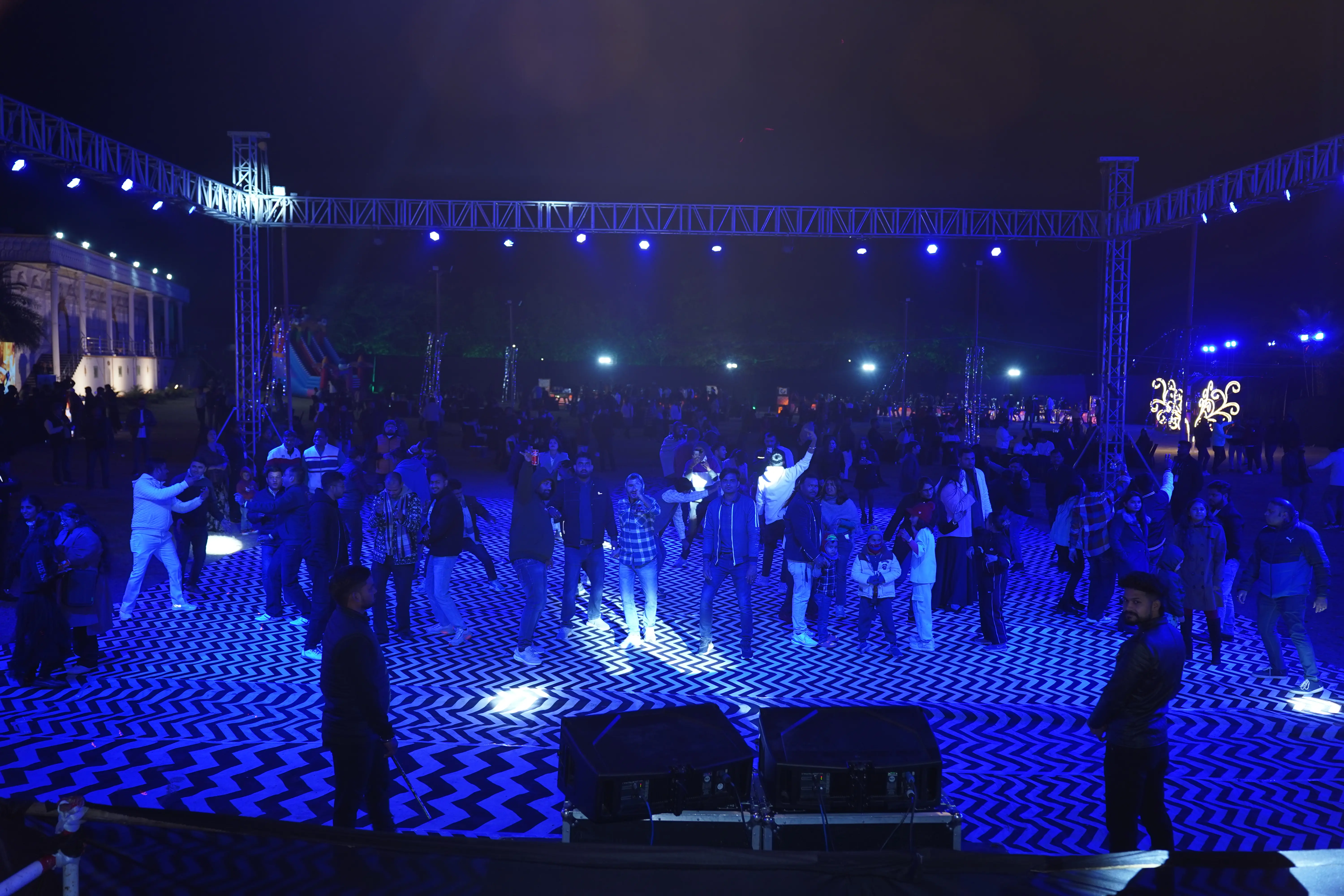 Concert crowd under gold lights